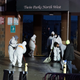 Staffs cleans the floor at the scene of a fatal fire at an apartment building in the Bronx on Sunday, Jan. 9, 2022, in New York.